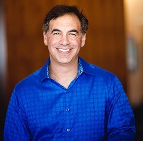 Evercoach-LA-2017---IMG_3494---Photo-by-All-Is-Amazing a man smiling for the picture