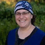Hila-Marcus a person wearing a blue and white hat