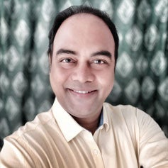 a person smiling for the camera