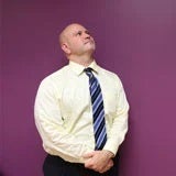 Raymond-J.-Negron a man in a tie