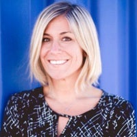 a woman smiling for the camera