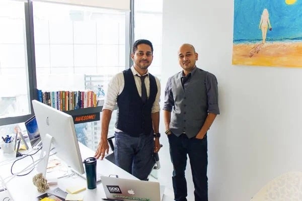 1-min (1) men standing in front of computers