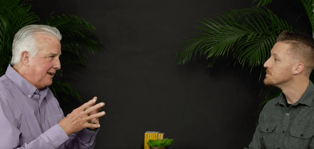 a man talking to another man