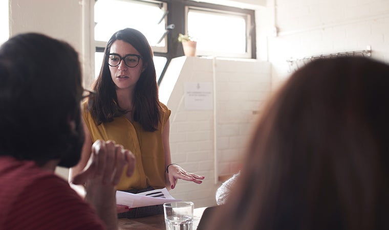 a group of people sitting at a table
