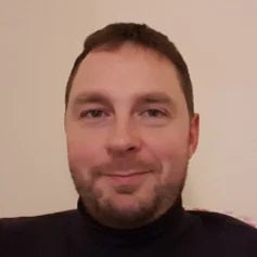 a man smiling for the camera