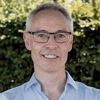 Testi-Michael-Simmonds a man wearing glasses