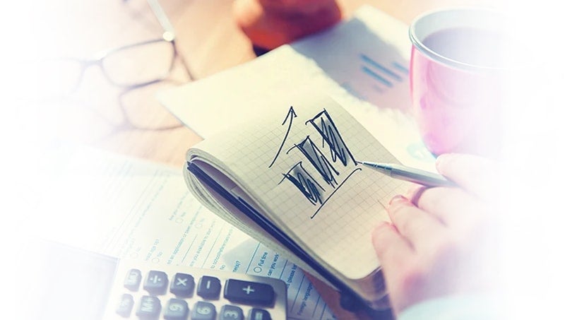 bonus-20-responsive-min a hand holding a pen and a pen