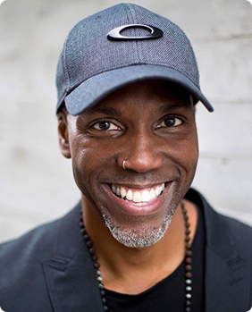 oren harris a man wearing a hat