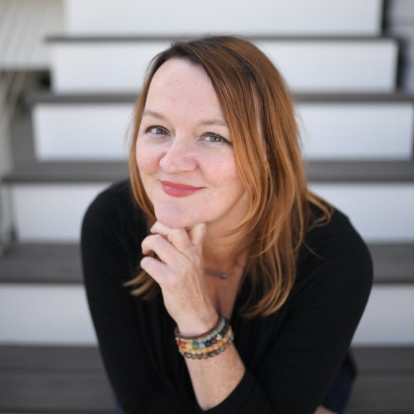 a woman with her hand on her chin