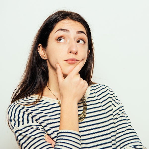 Woman-Doubting a woman with her hand on her chin